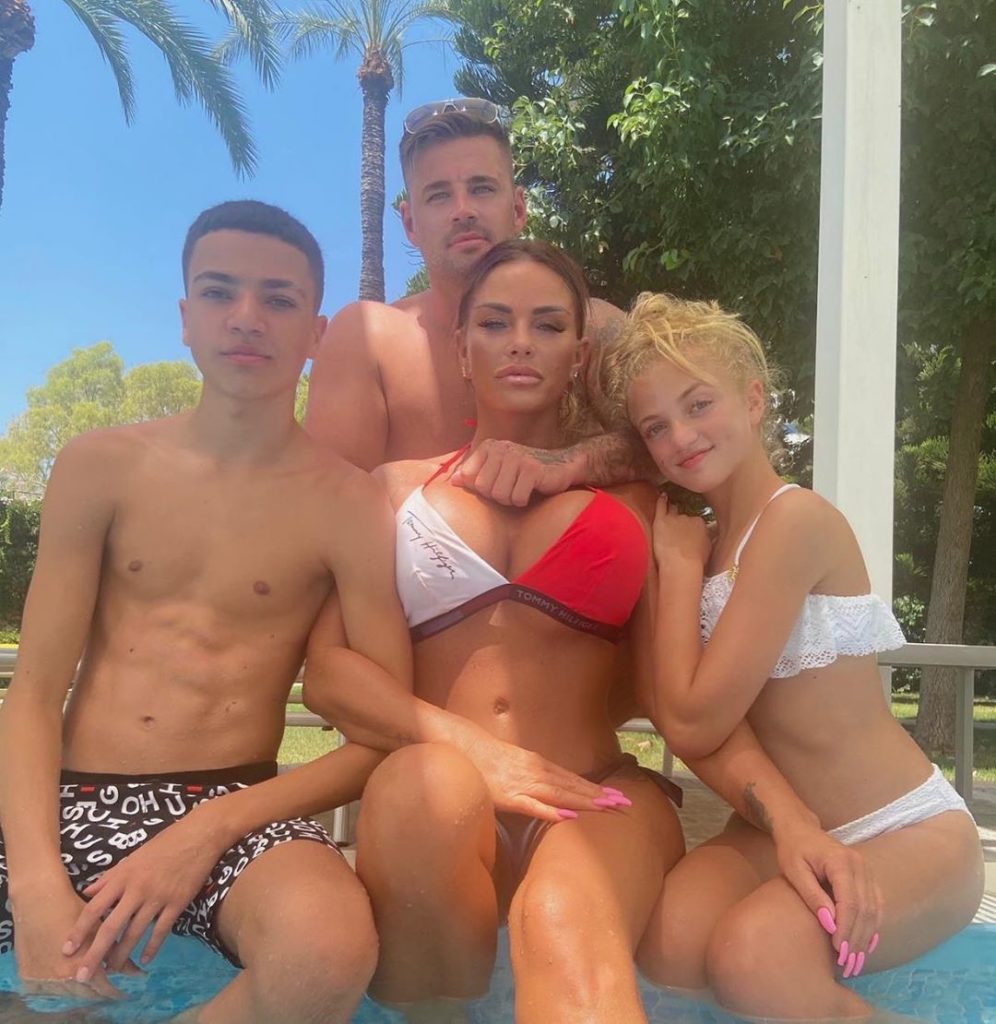 katie price The mum-of-five, who has been enjoying some sun with boyfriend Carl Woods, 31, and her children Junior, 15, and Princess, 13